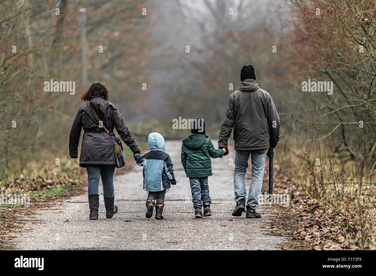 Family, mother, father, two children on a walk, Stock Photo