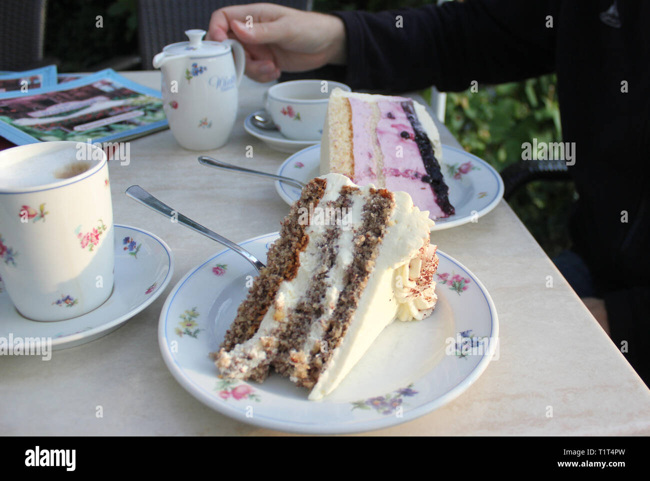 German nut cake, german cream torte with cannikin coffee. Stock Photo