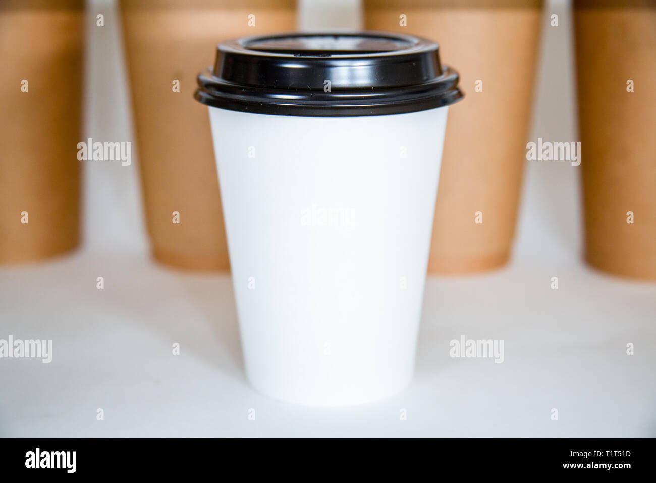 Different colored coffee cups isolated on a white background. Stock Photo