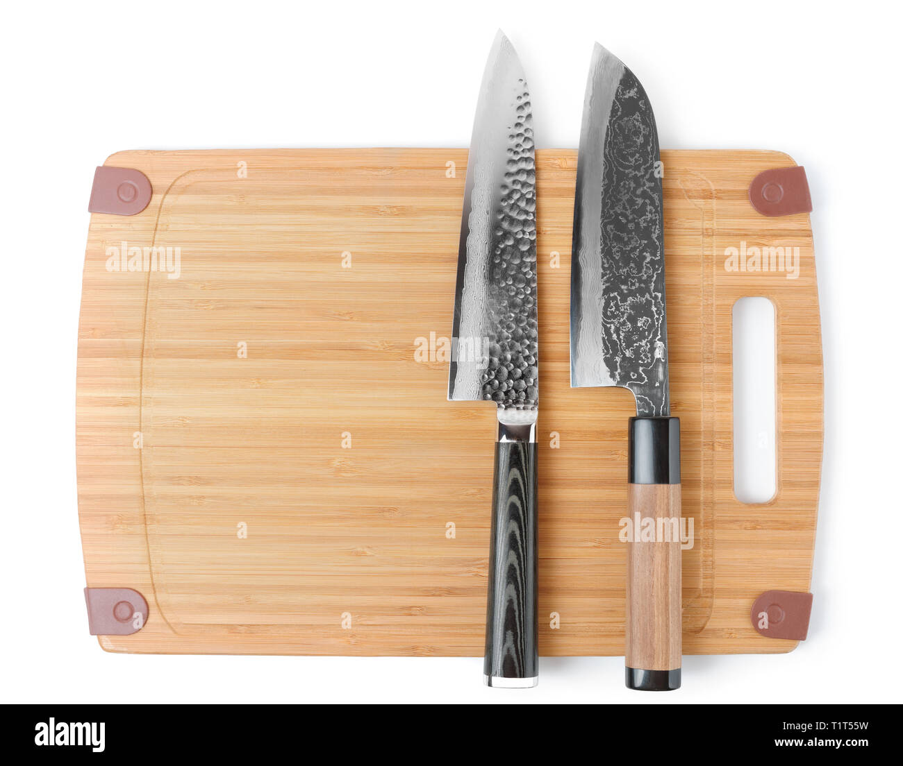 Two expensive japanese knives on cutting board, isolated Stock Photo