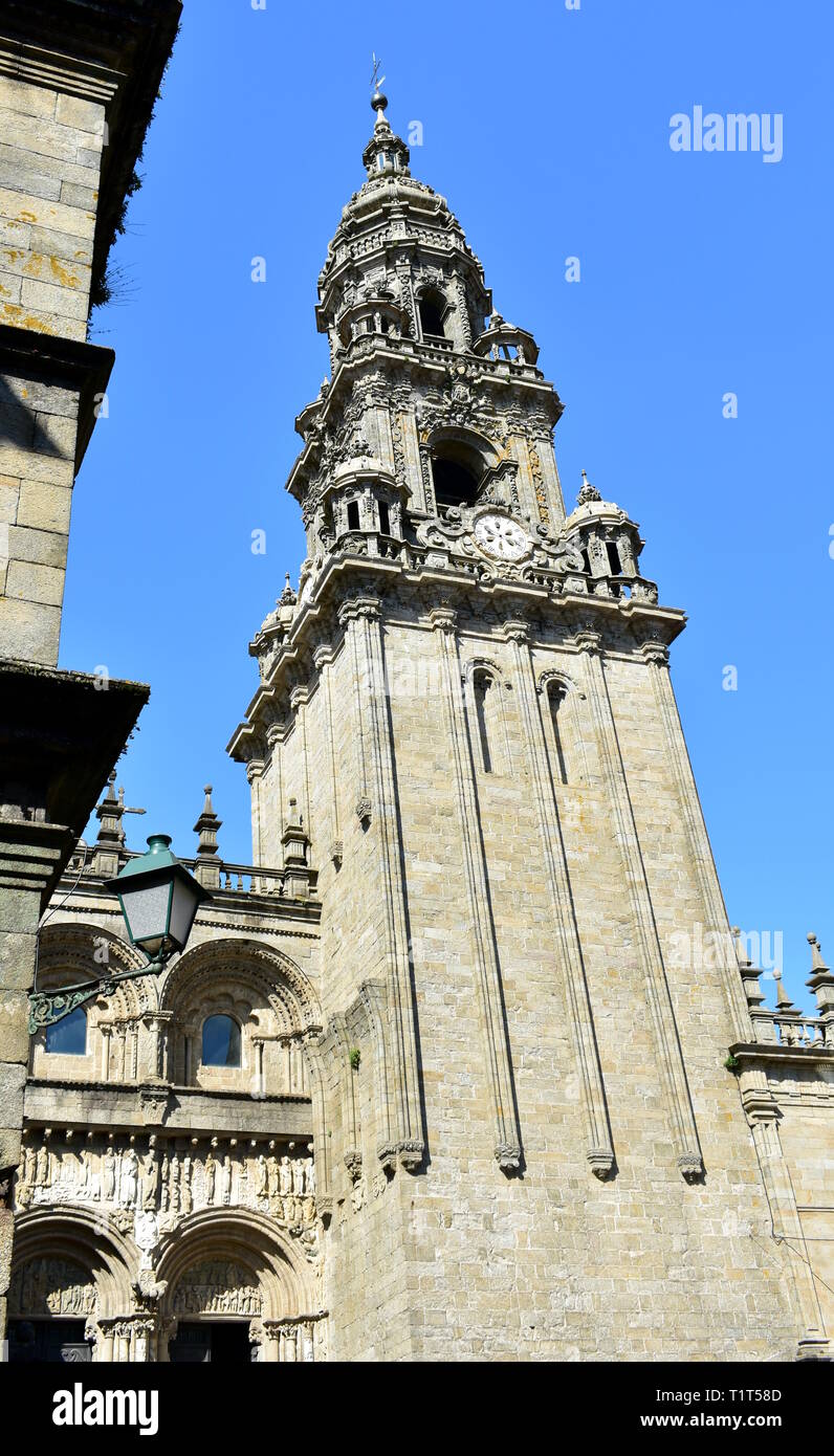 Cathedral, Platerias romanesque facade, baroque clock tower and streetlight. Santiago de Compostela, Spain. Stock Photo