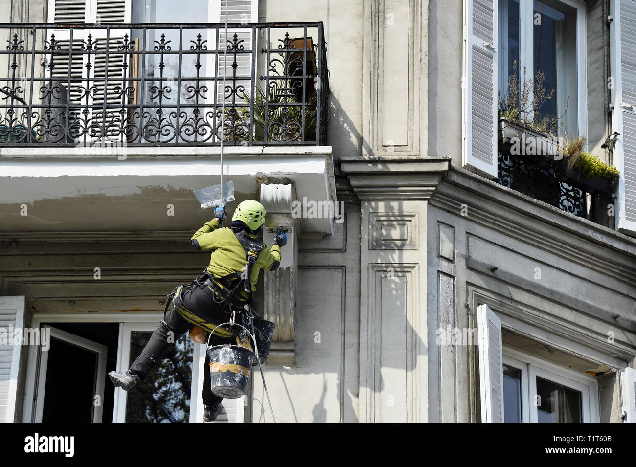 Worker at height - Place de Clichy - Paris - France Stock Photo