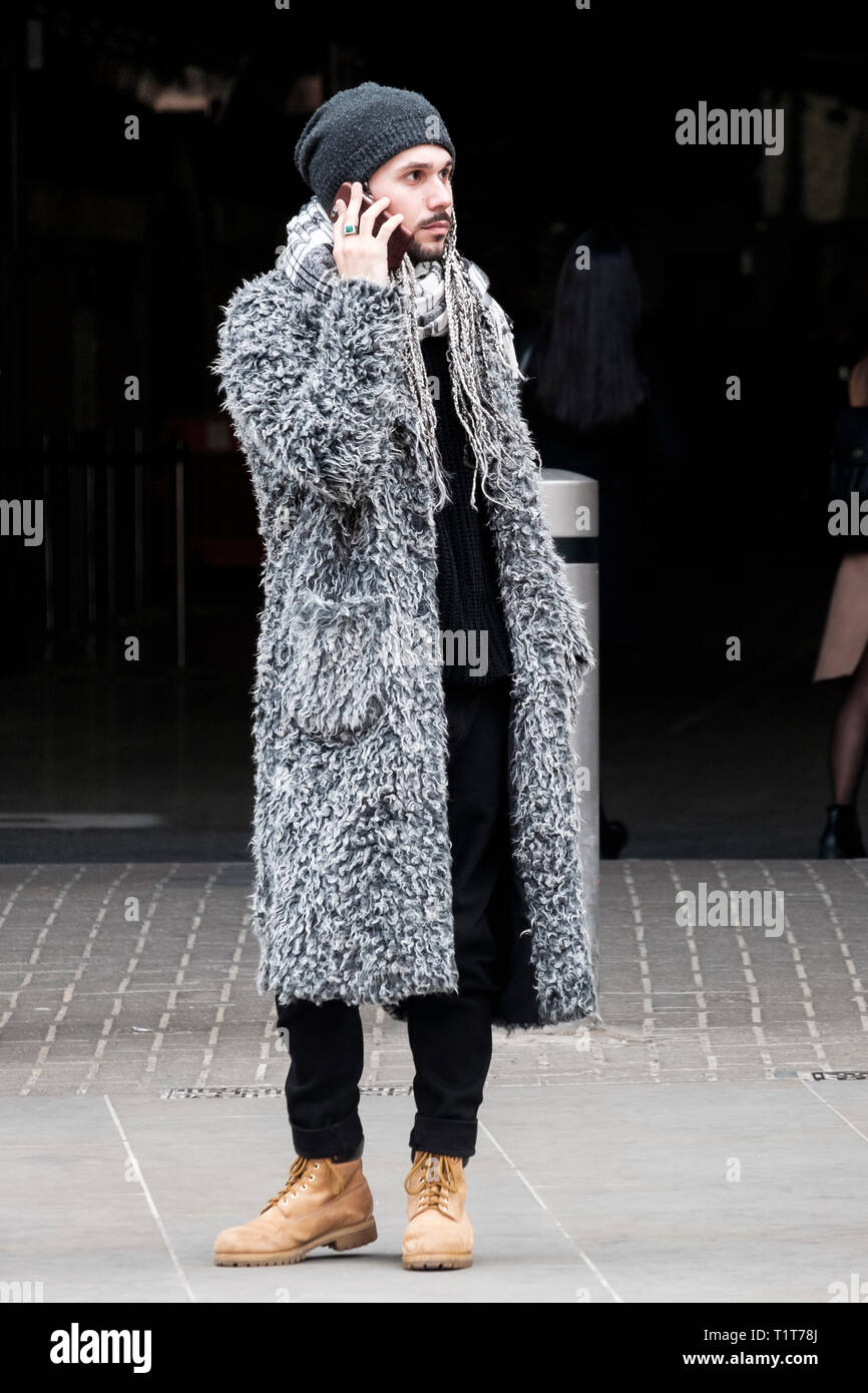 London street fashion: Man wearing teddy bear coat Stock Photo