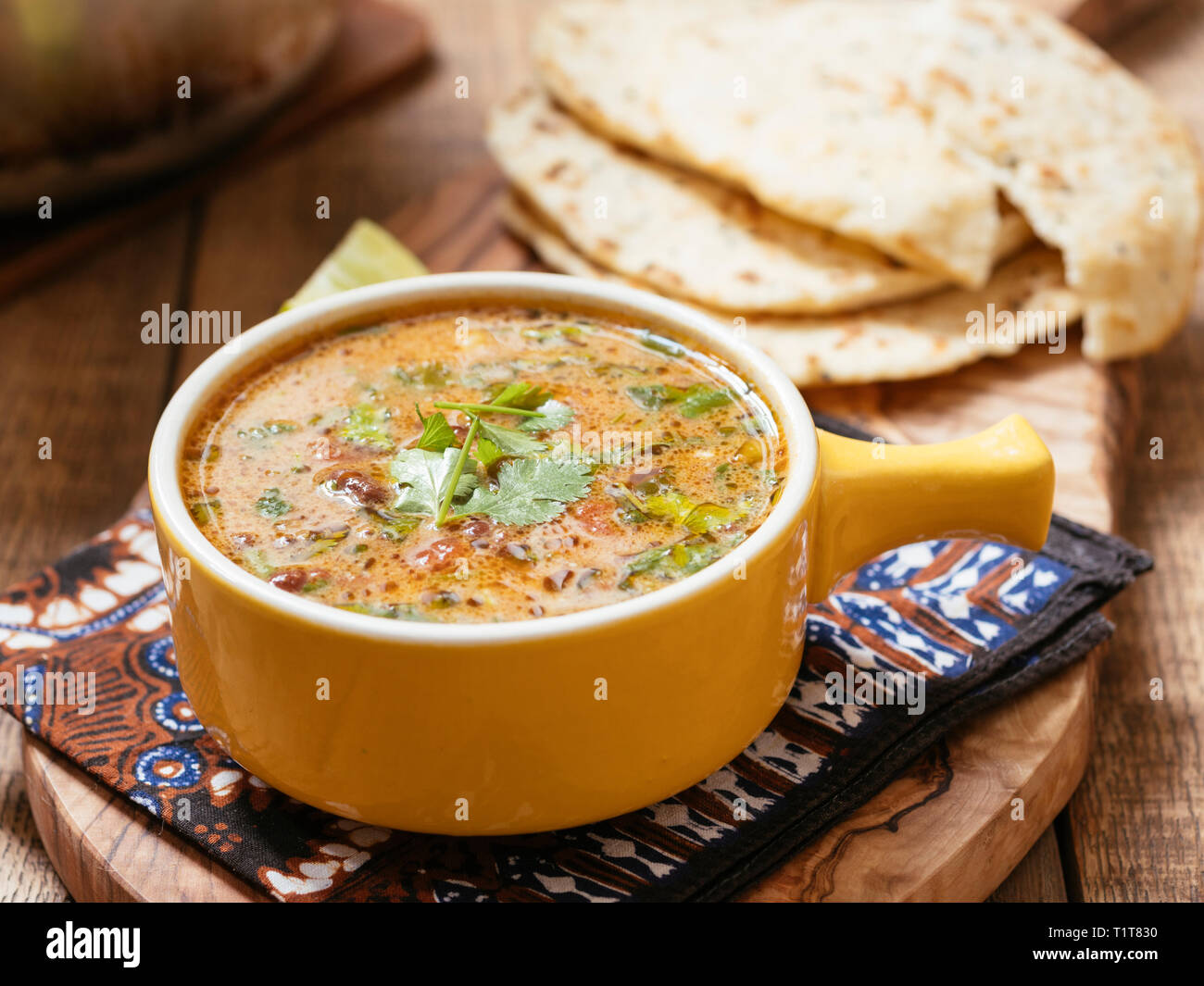 Curried Mung Bean Soup with Naan Breads Stock Photo