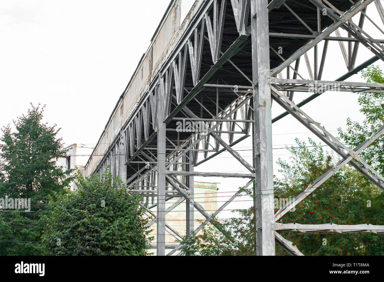 steel technical design of overhead crossing. industrial footbridge on sky  background Stock Photo - Alamy