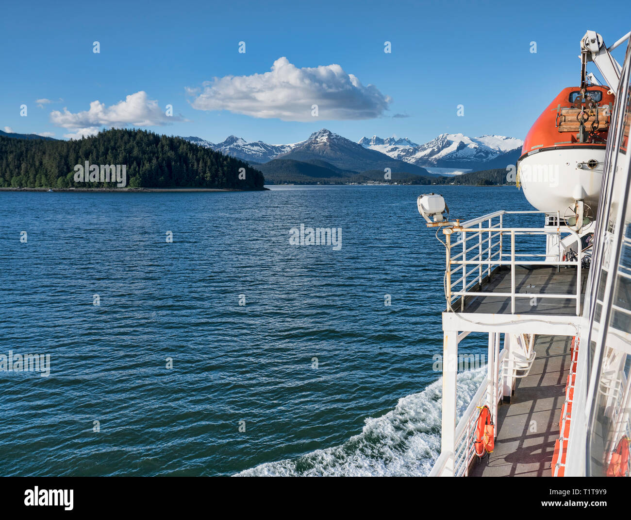 View from a ferry in Southeast Alaska in summer on a sunny day. Stock Photo