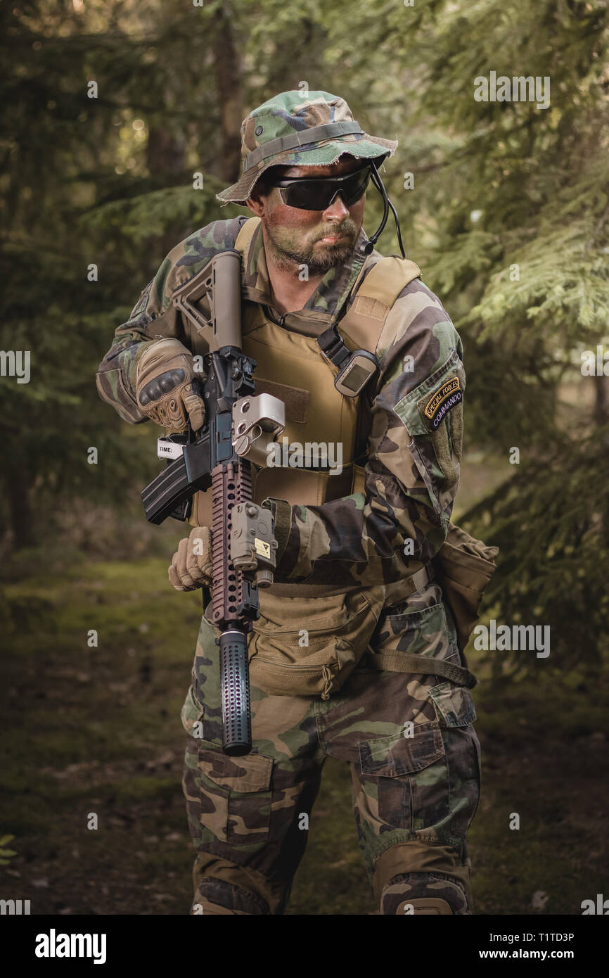 Special Forces soldier with an assault rifle in the forest Stock Photo ...