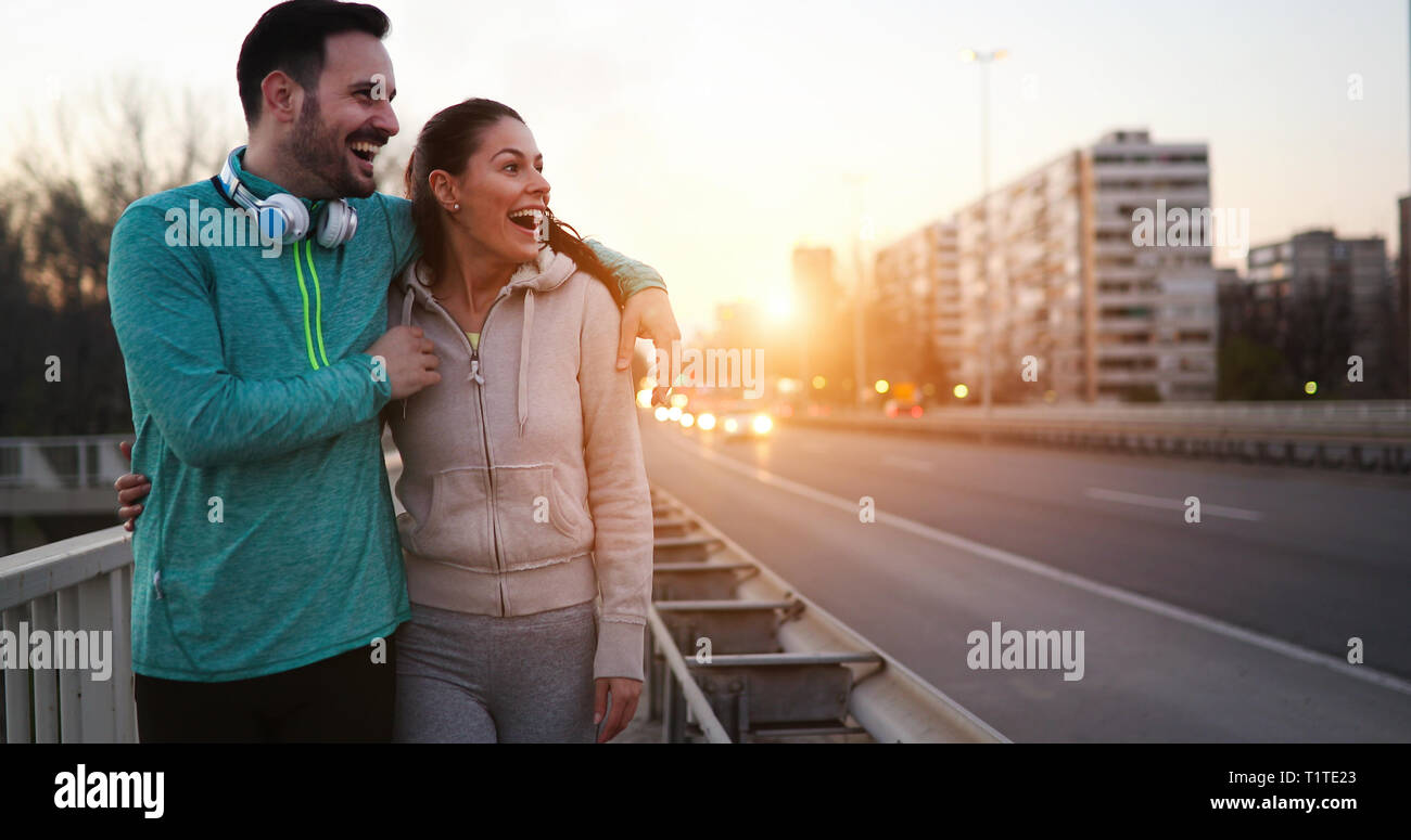 Happy young sporty couple sharing romantic moments Stock Photo - Alamy