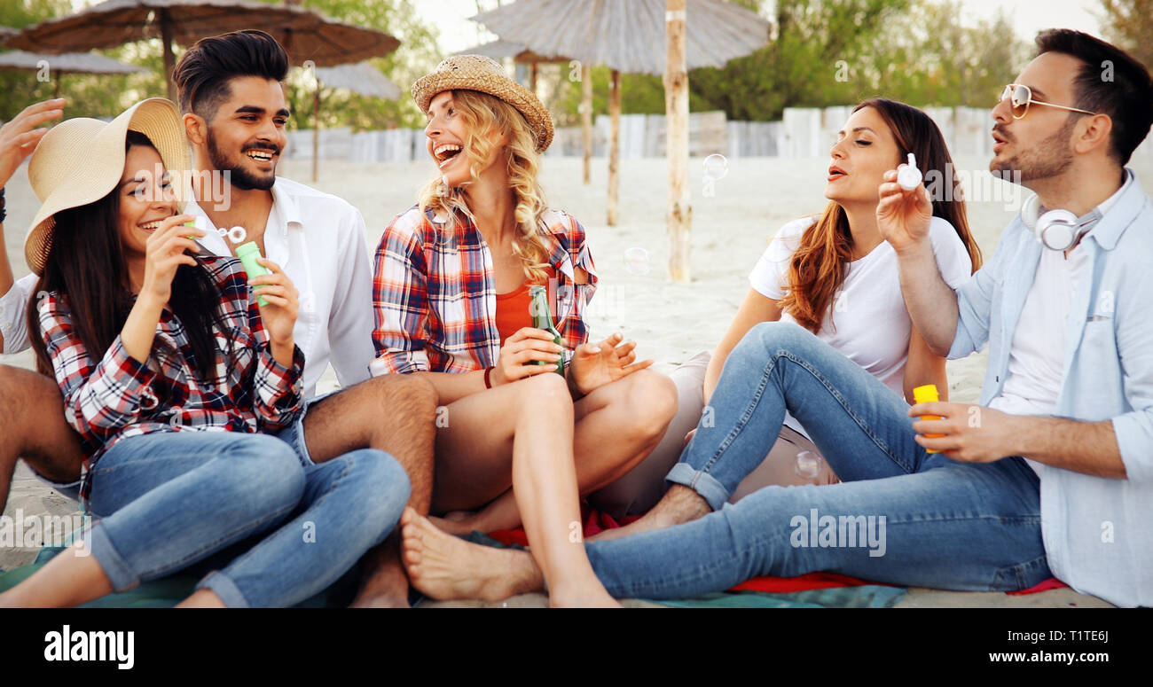 Happy friends laughing and smiling outdoors Stock Photo - Alamy