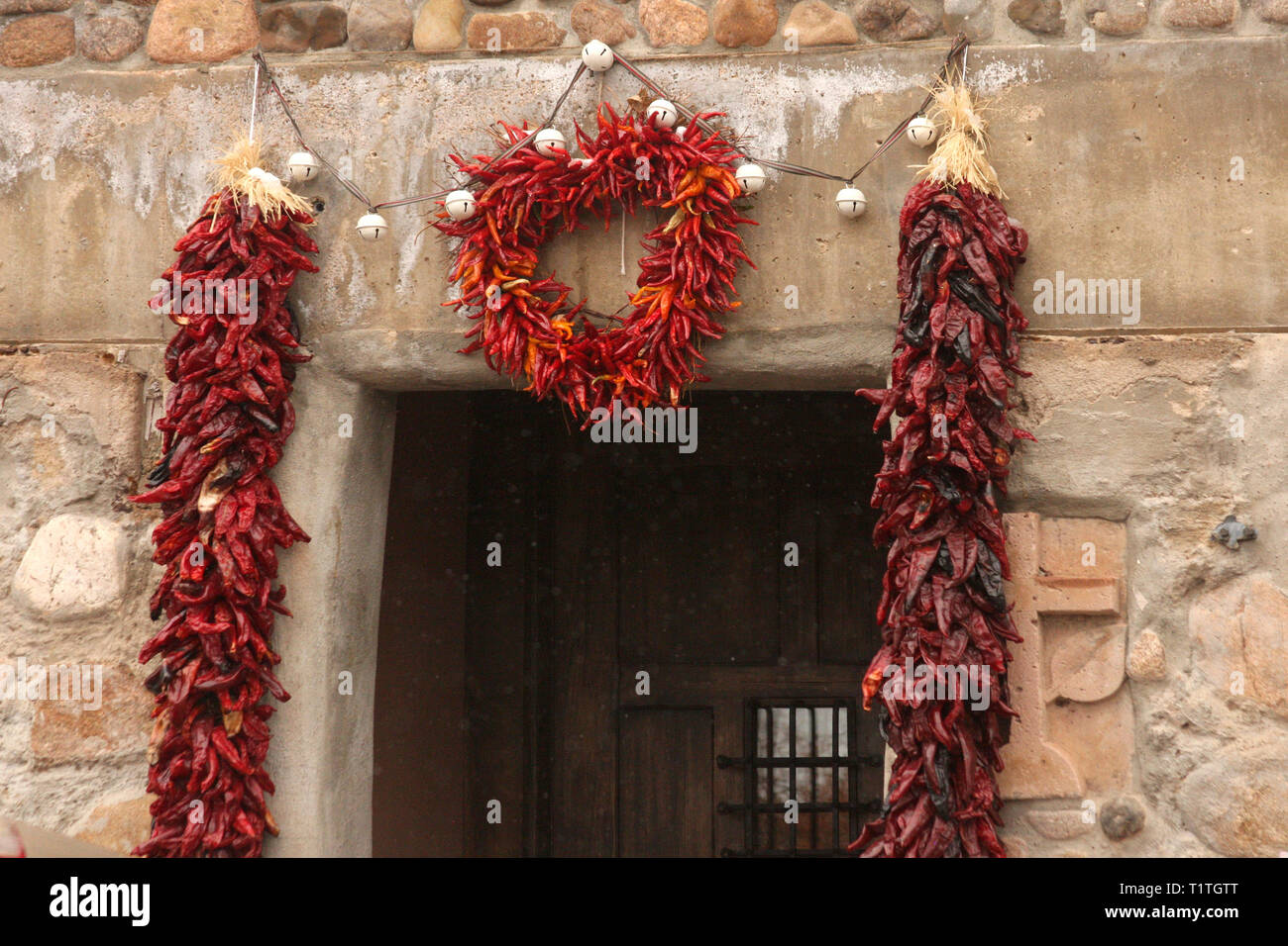 Dried red peppers (Ristras) decorating the entrance of a house in Santa