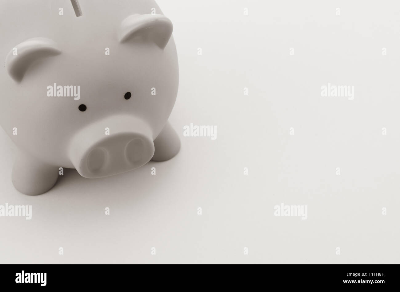 gray piggy bank on a blank surface - investments and savings concept Stock Photo