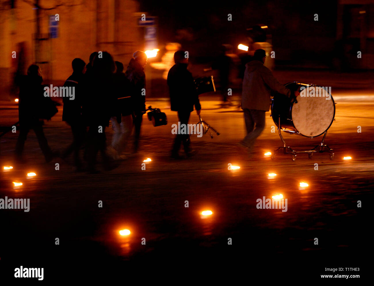 People in a square during Earth Hour. Stock Photo