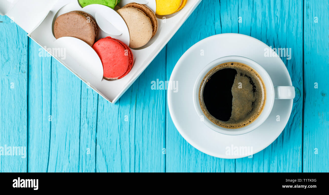 Macaroons with coffee on table Stock Photo