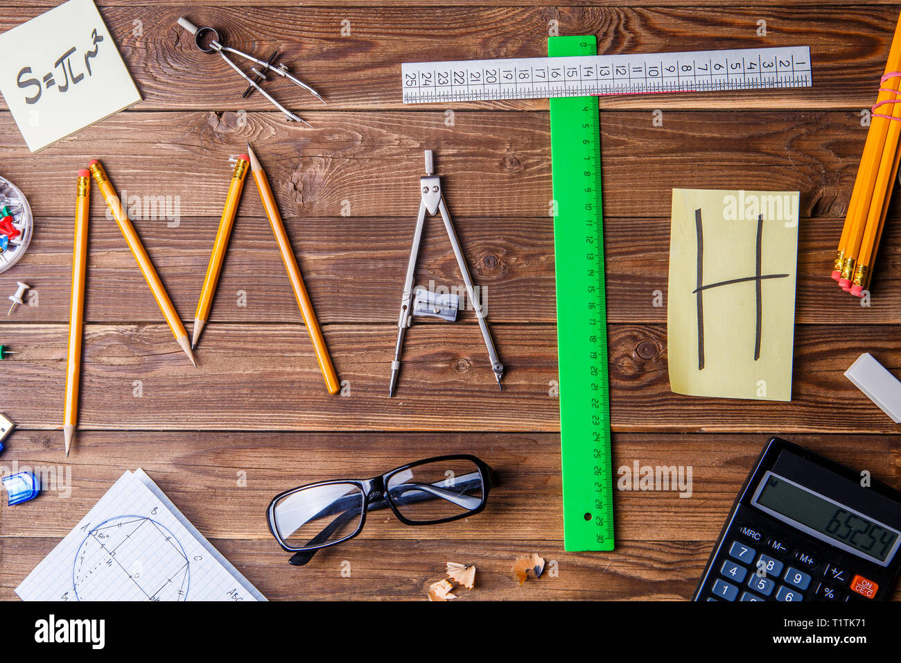 Text math composed of pencils, rulers, circular, sharpener and sticker ...