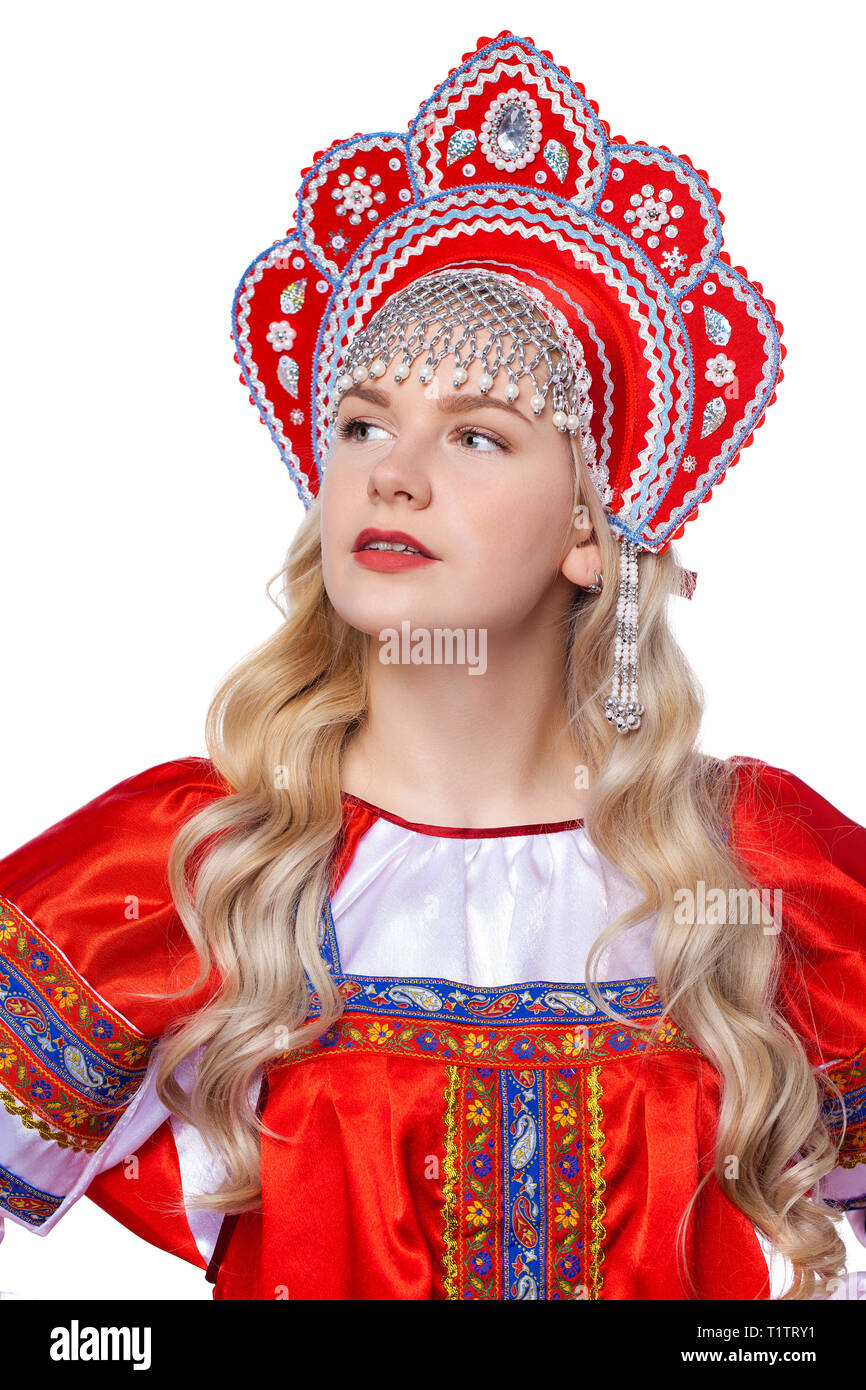 Traditional Russian folk costume, portrait of a young beautiful blonde girl in red dress, isolated on white background Stock Photo