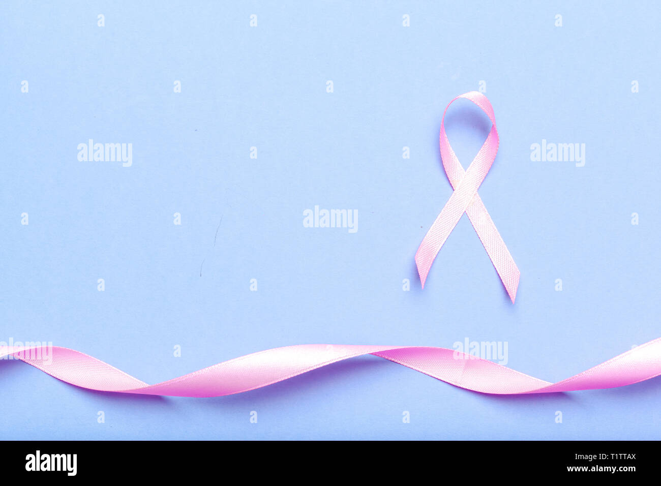 ribbon HIV, AIDS on blue background Stock Photo - Alamy