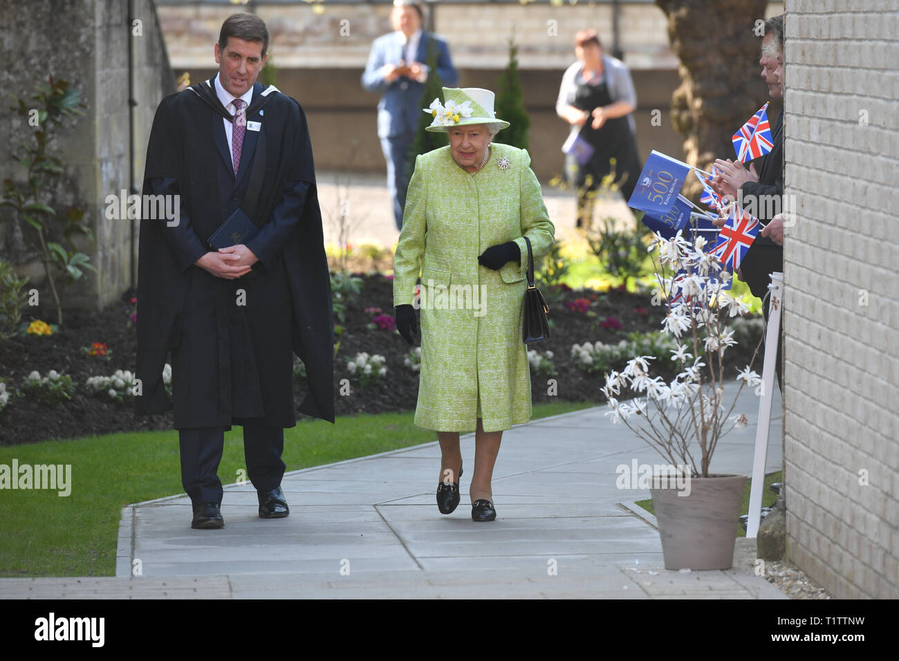 Queen Elizabeth II with headmaster Ian Wilmshurst during a visit to