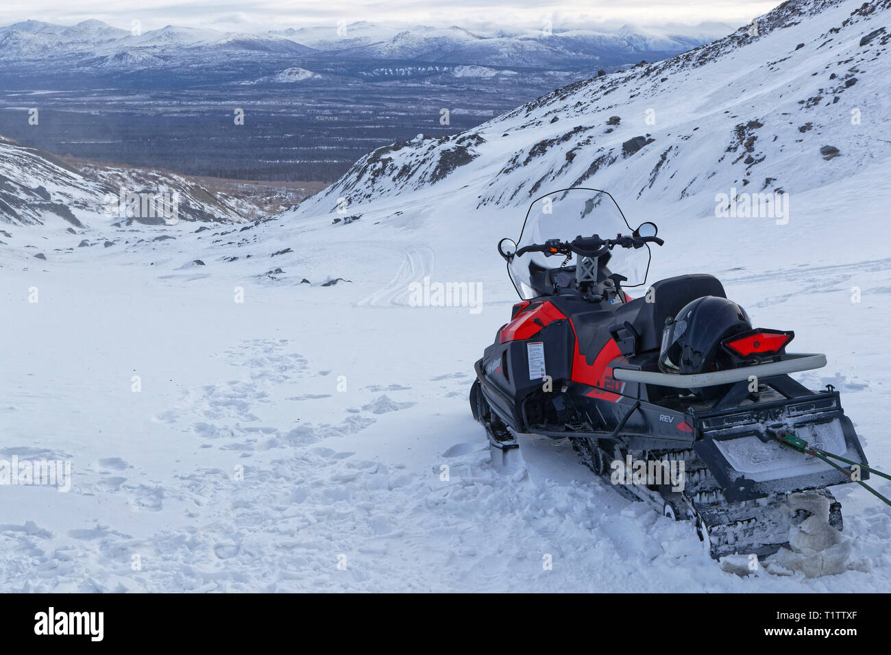 HAINES JUNCTION, YUKON, CANADA, March 12, 2019 : Journey are organized on icefields with snowmobiles. Stock Photo