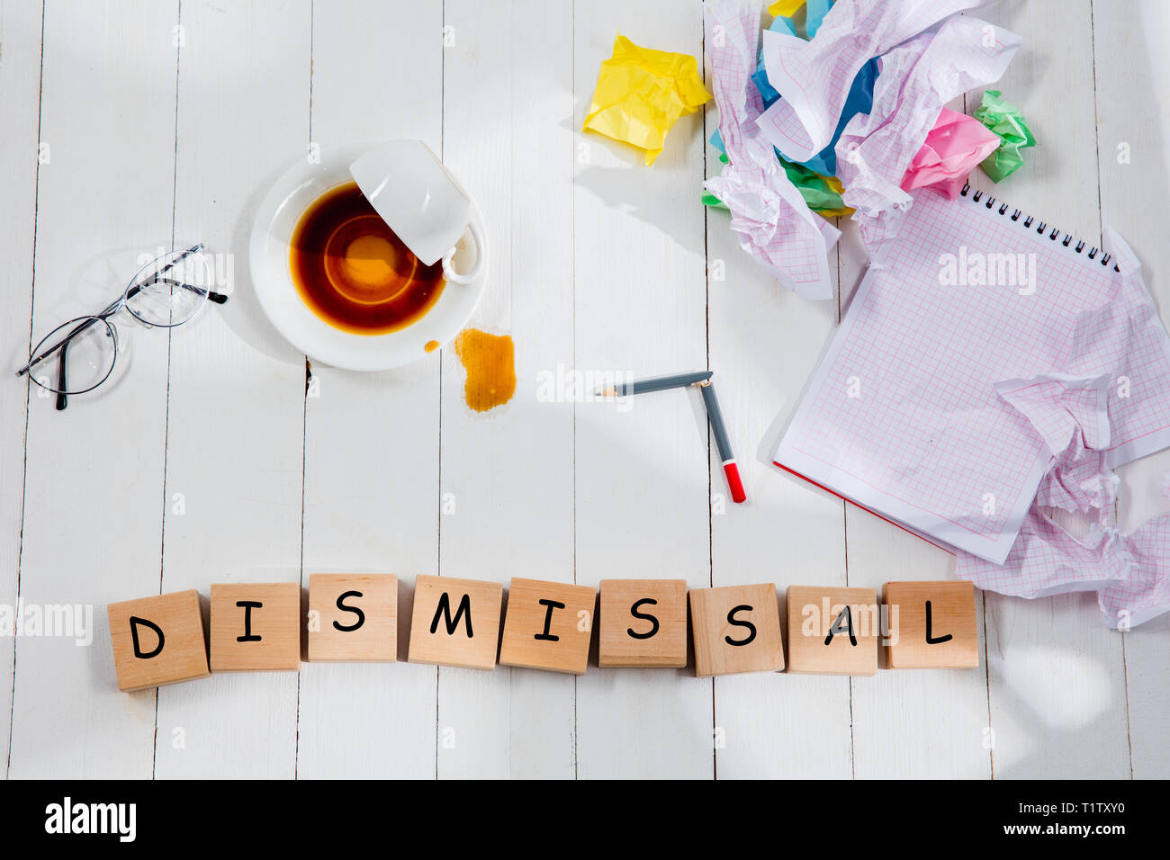 Dismissal. Message in wooden cubes on a table background. Lifestyle, business, office, management and career concept. Top or flat lay view. Stock Photo