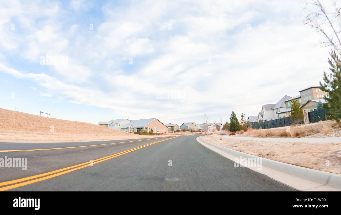Driving through new residential neighborhood in suburbia Stock Photo
