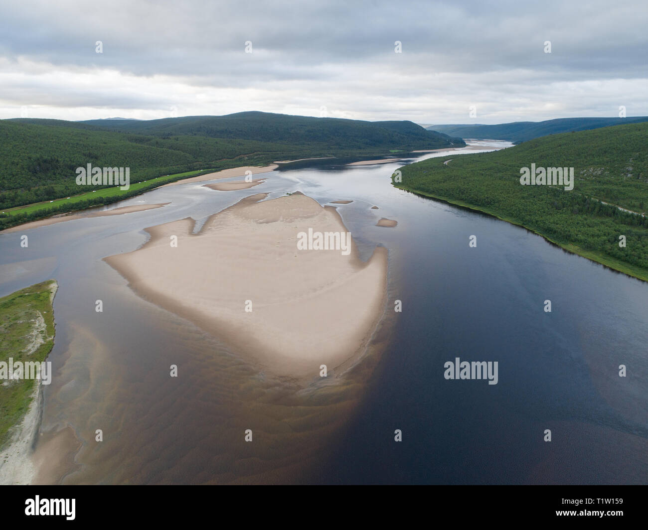 Aerial view of Teno aka Tana river between Norway and Finland at summer. Teno river is well known for its salmon fishery. Stock Photo