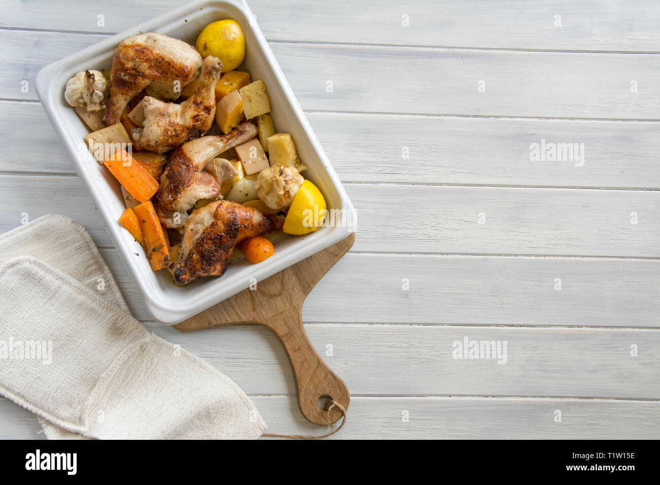 Chicken and root vegetables tray bake recipe Stock Photo Alamy