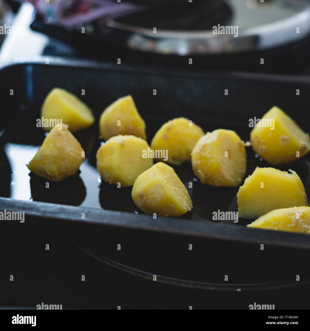 Potatoes in goose fat ready to be cooked for Christmas Stock Photo Alamy