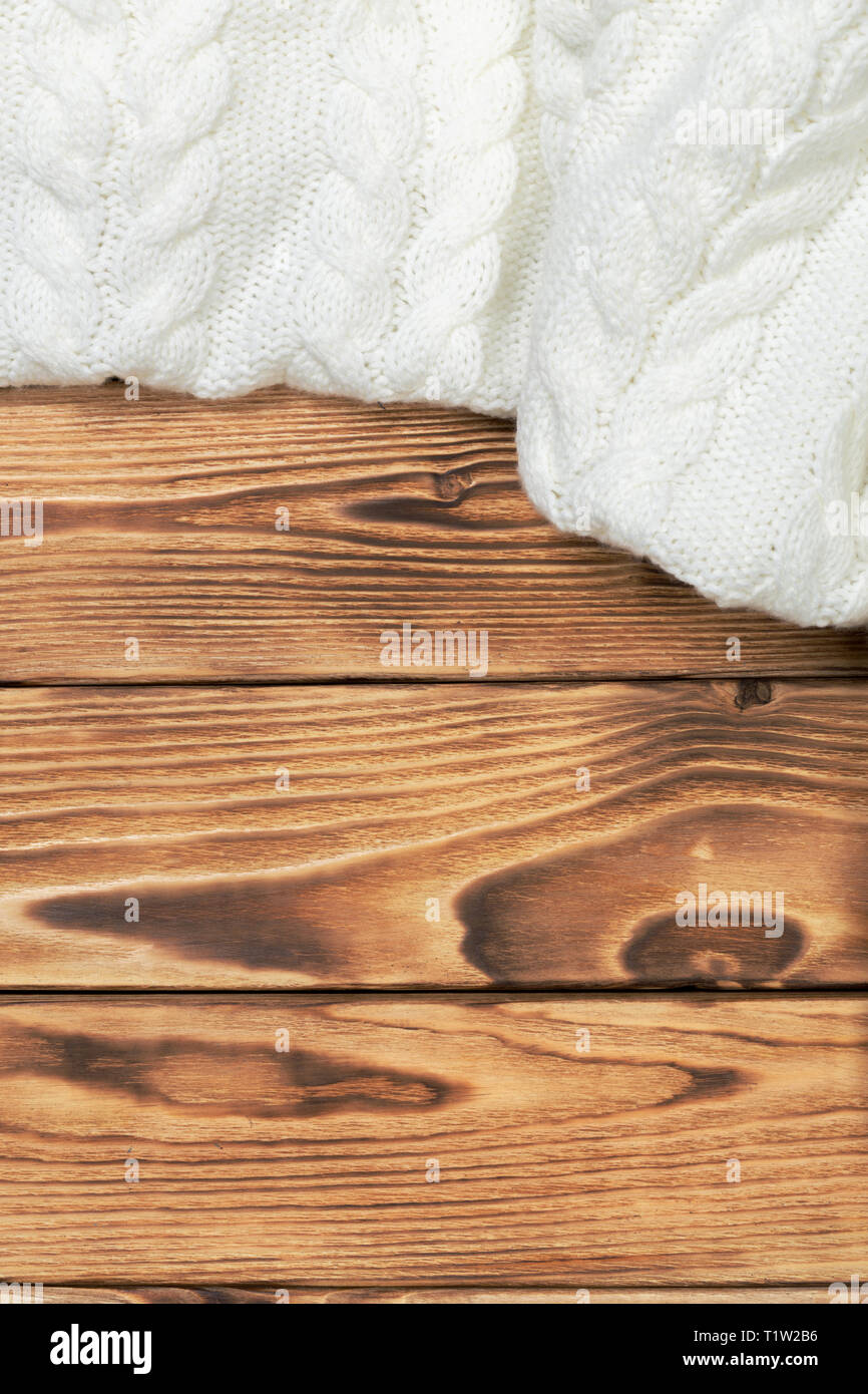 cozy knitted blanket on wooden boards Stock Photo Alamy