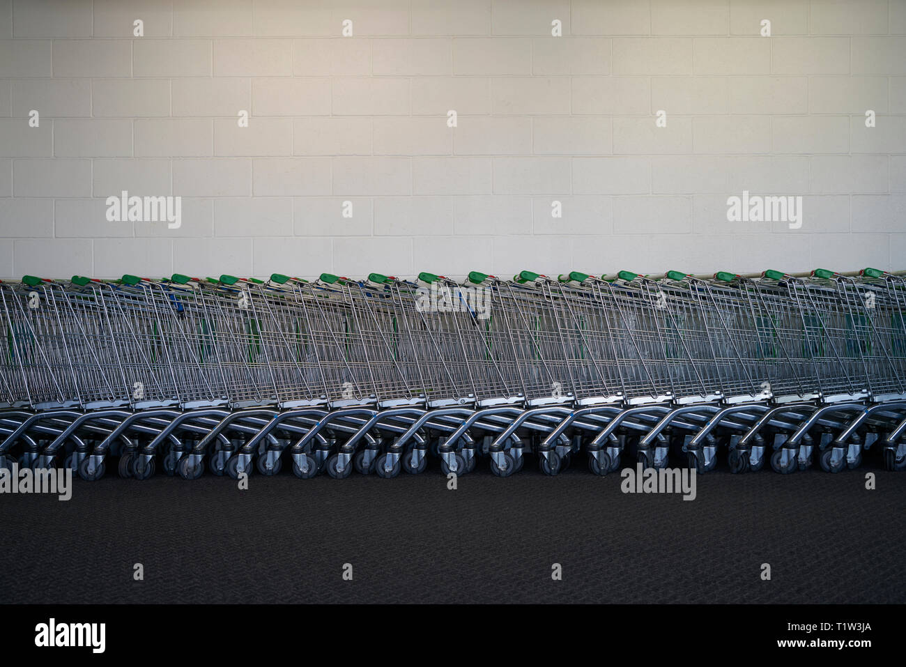 Shopping trolleys in Asda Stock Photo