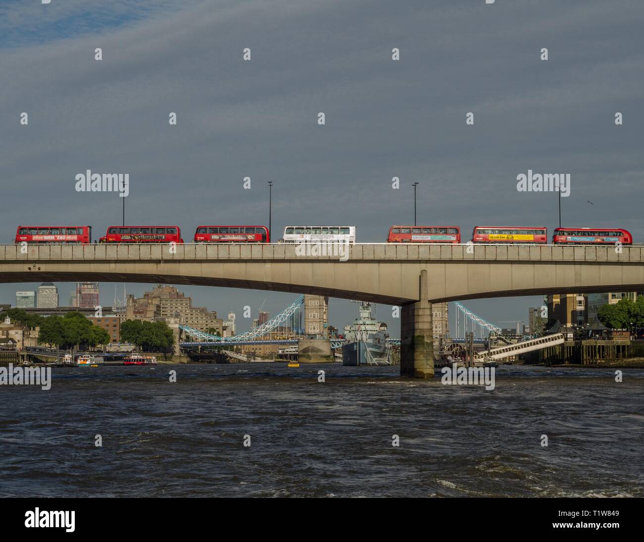 A queue of double-decker buses attempting to cross London Bridge, London, England. Stock Photo