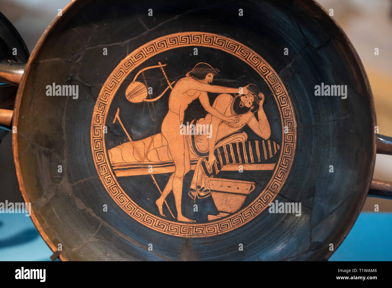 Copenhagen. Denmark. Attic red-figure kylix (drinking cup), a slave boy holds the head of vomiting symposiast. Cup by the Brygos Painter, 500-470 BC.  Stock Photo