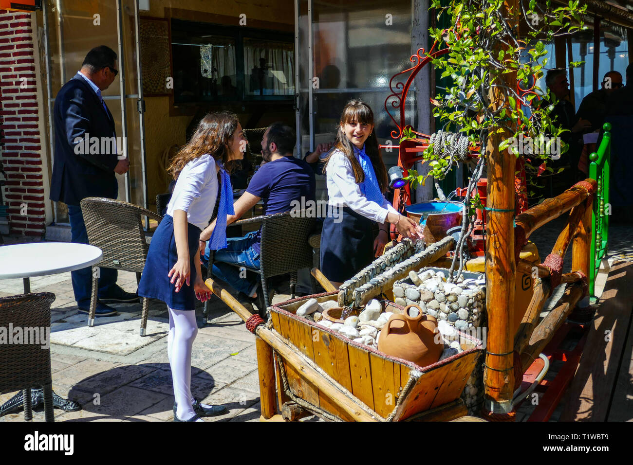 Families enjoying sunshine in Ancient Corinth on Greek Independence Day, March 25th Stock Photo