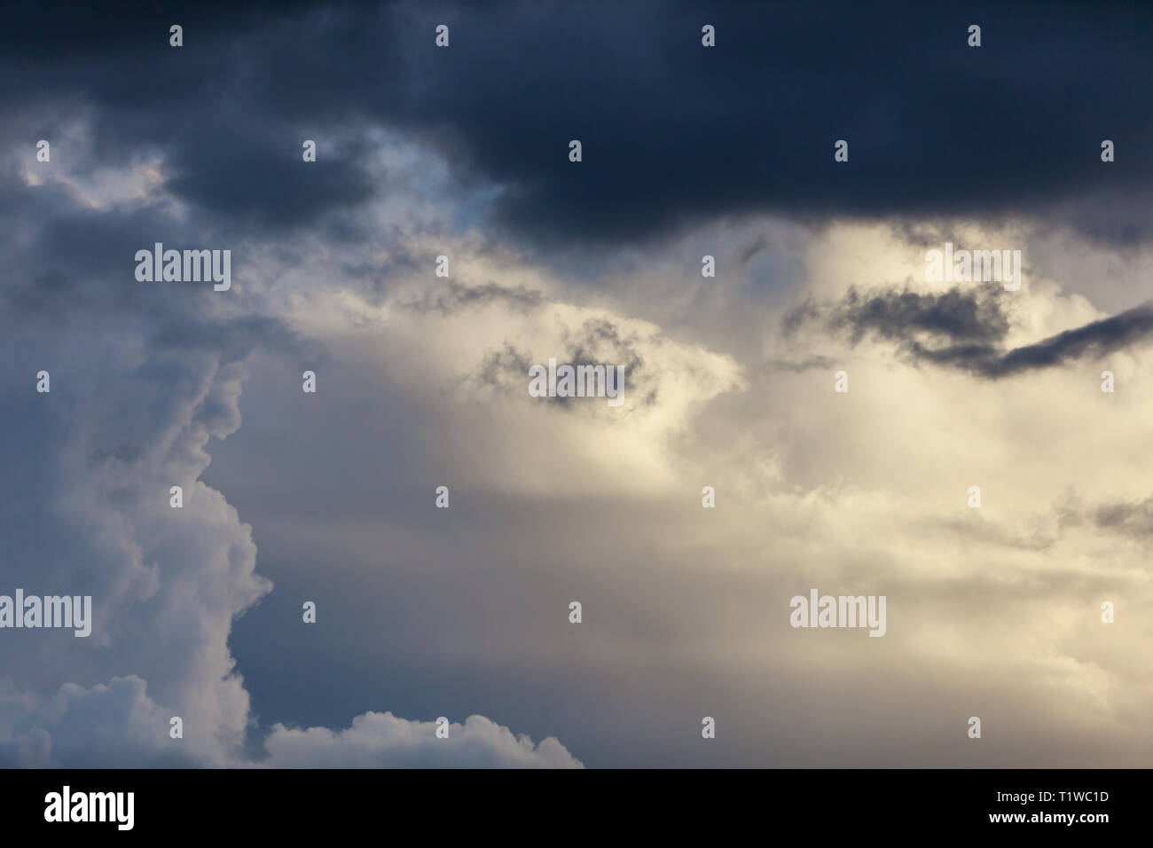Beautiful image of cloud mix in Oklahoma with white clouds through darker blue clouds. Stock Photo