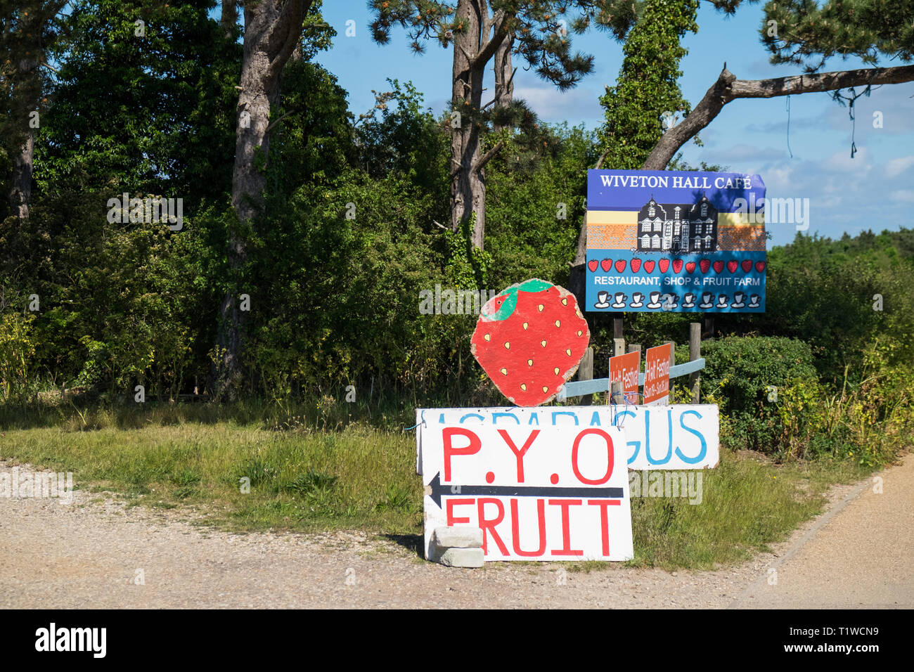 Signs pointing to pick your own strawberries at Wiveton Hall Fruit Farm and Cafe in North Norfolk, England. Stock Photo