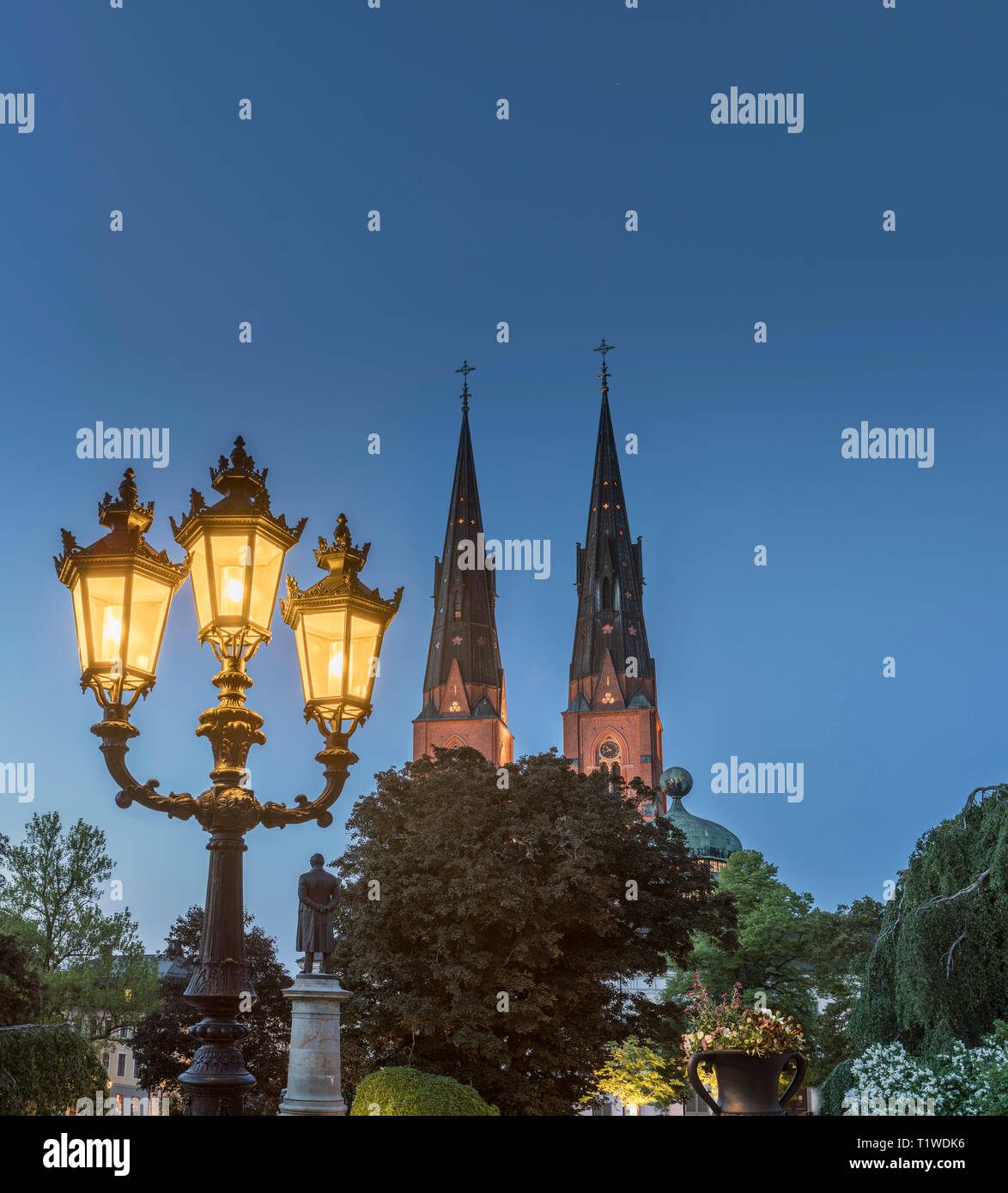 Old lamp post and the Cathedral and Gustavianum at night. View from the University park, Uppsala, Sweden, Scandinavia Stock Photo