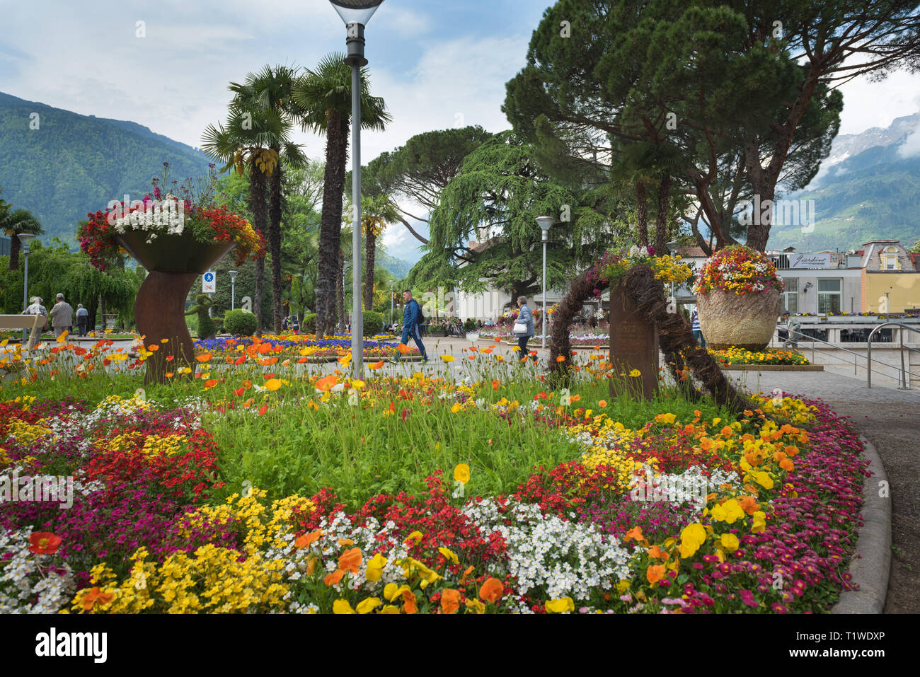 Merano/Italy - 05/05/18: in South Tyrol, a beautiful city of Trentino Alto Adige, View on the famous promenade along the Passirio river. Northern Ital Stock Photo