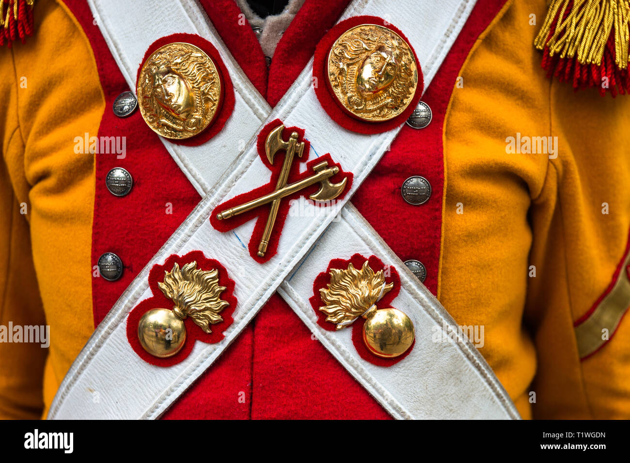 MOSCOW, AUGUST 16, 2018. Details of a military uniform of Napoleon army. Ensigns on leather belts across the yellow and red coat. International Times  Stock Photo