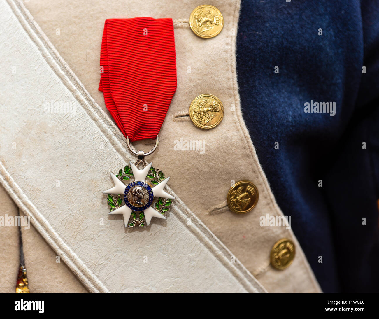 MOSCOW, AUGUST 16, 2018. Napoleon era Order of the Legion of Honor hangs on a red ribbon on a French army uniform during International Times and Epoch Stock Photo