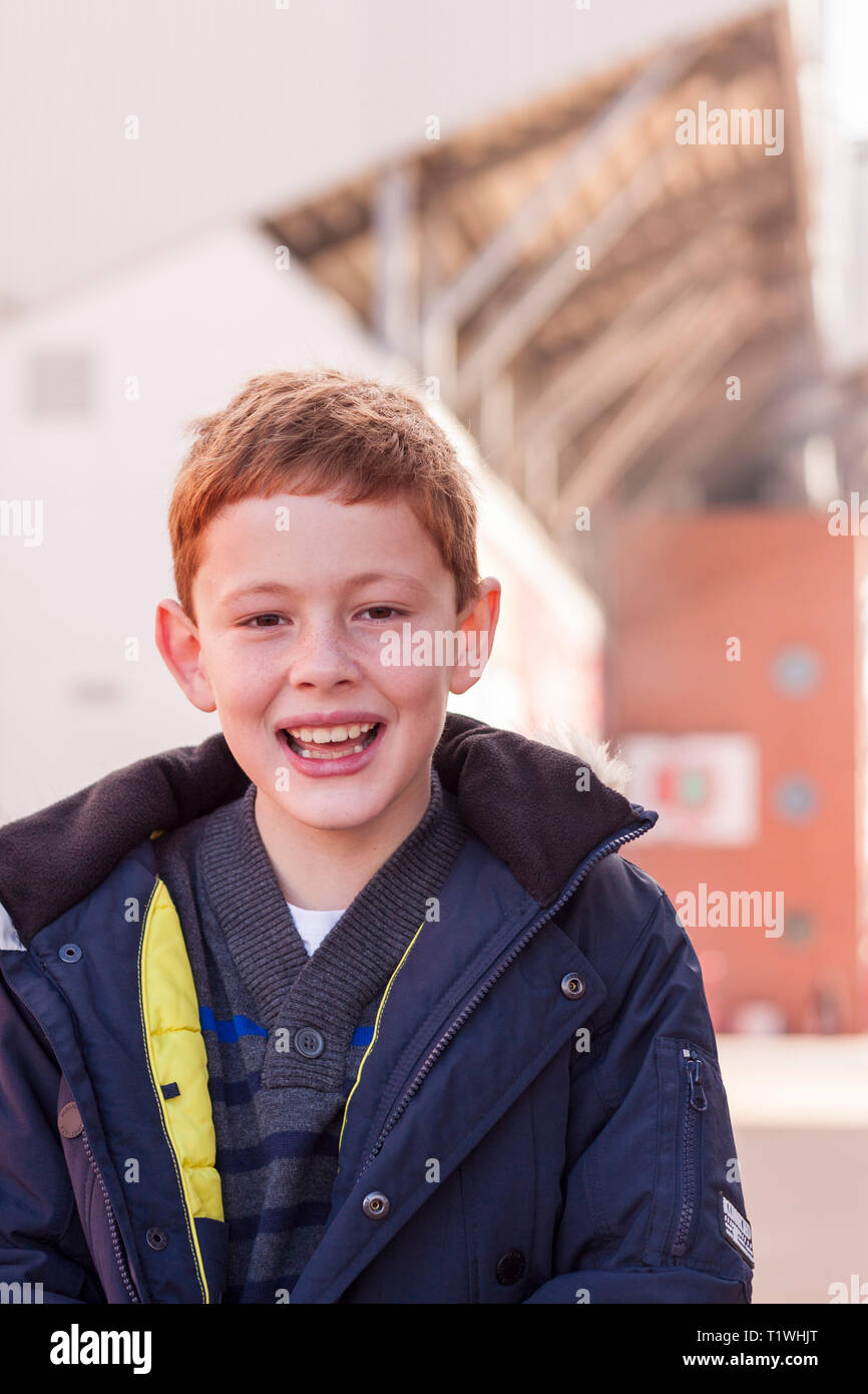 Portrait of a young boy outside Anfield, the home of Liverpool FC. Merseyside, UK Stock Photo