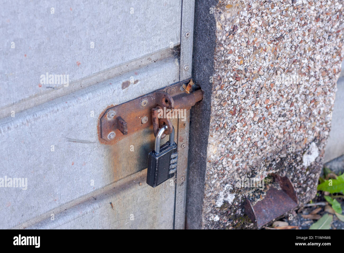 Close-up of a combination padlock on a garage door Stock Photo