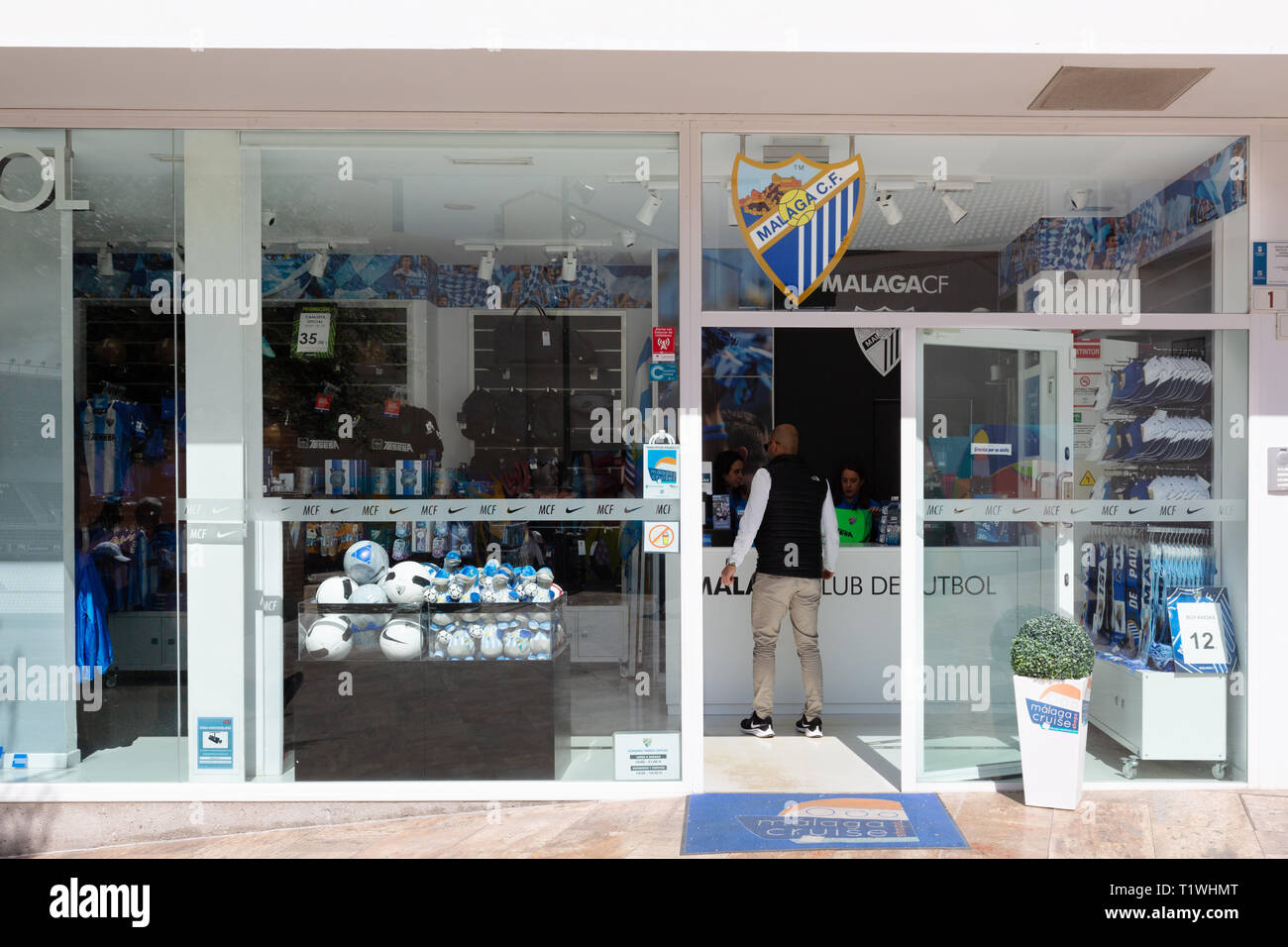Malaga CF, or Malaga Club de futbol - the exterior of the Malaga Football Club shop in Malaga Andalusia Spain Stock Photo