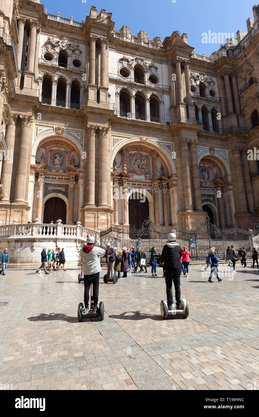 People on a segway tour of Malaga Spain, Plaza del Obispo, Malaga old town, Malaga Andalusia Spain Europe Stock Photo