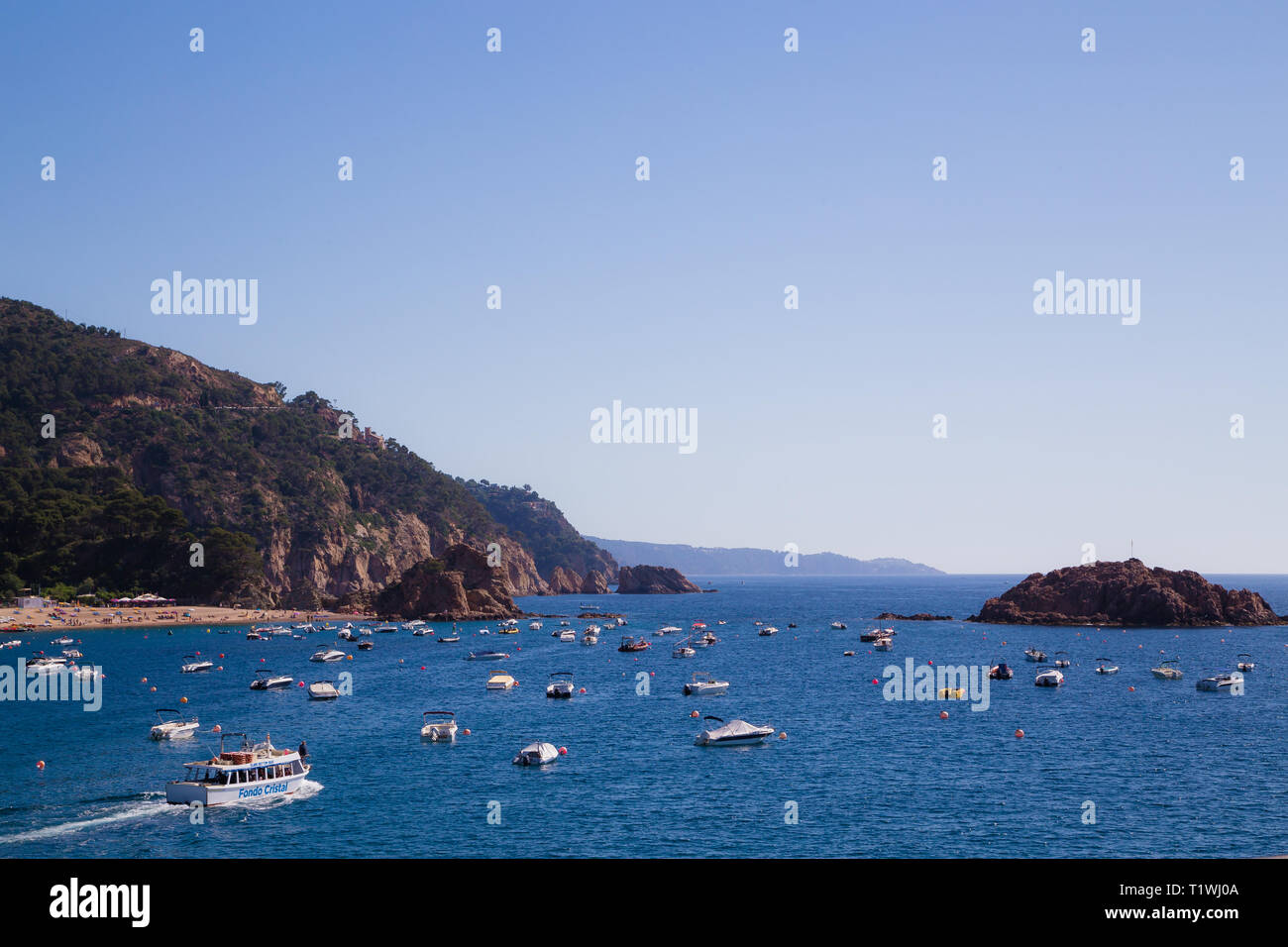 Boat trip Tossa De Marr Spain. Tourists on a pleasure cruise seeing the sights of the bay. Stock Photo