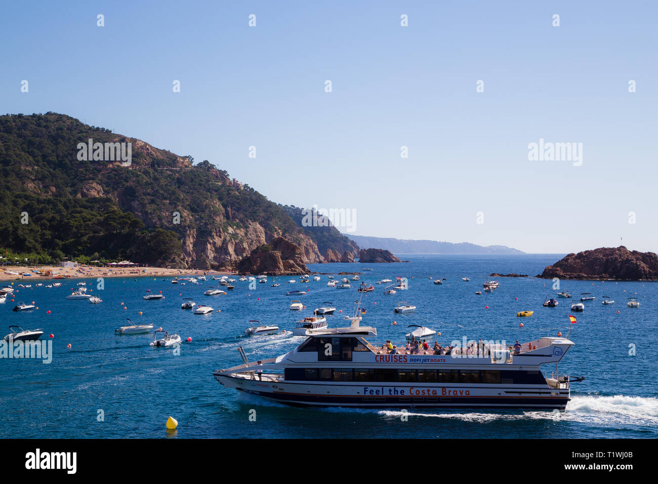 Boat trip Tossa De Marr Spain. Tourists on a pleasure cruise seeing the sights of the bay. Stock Photo