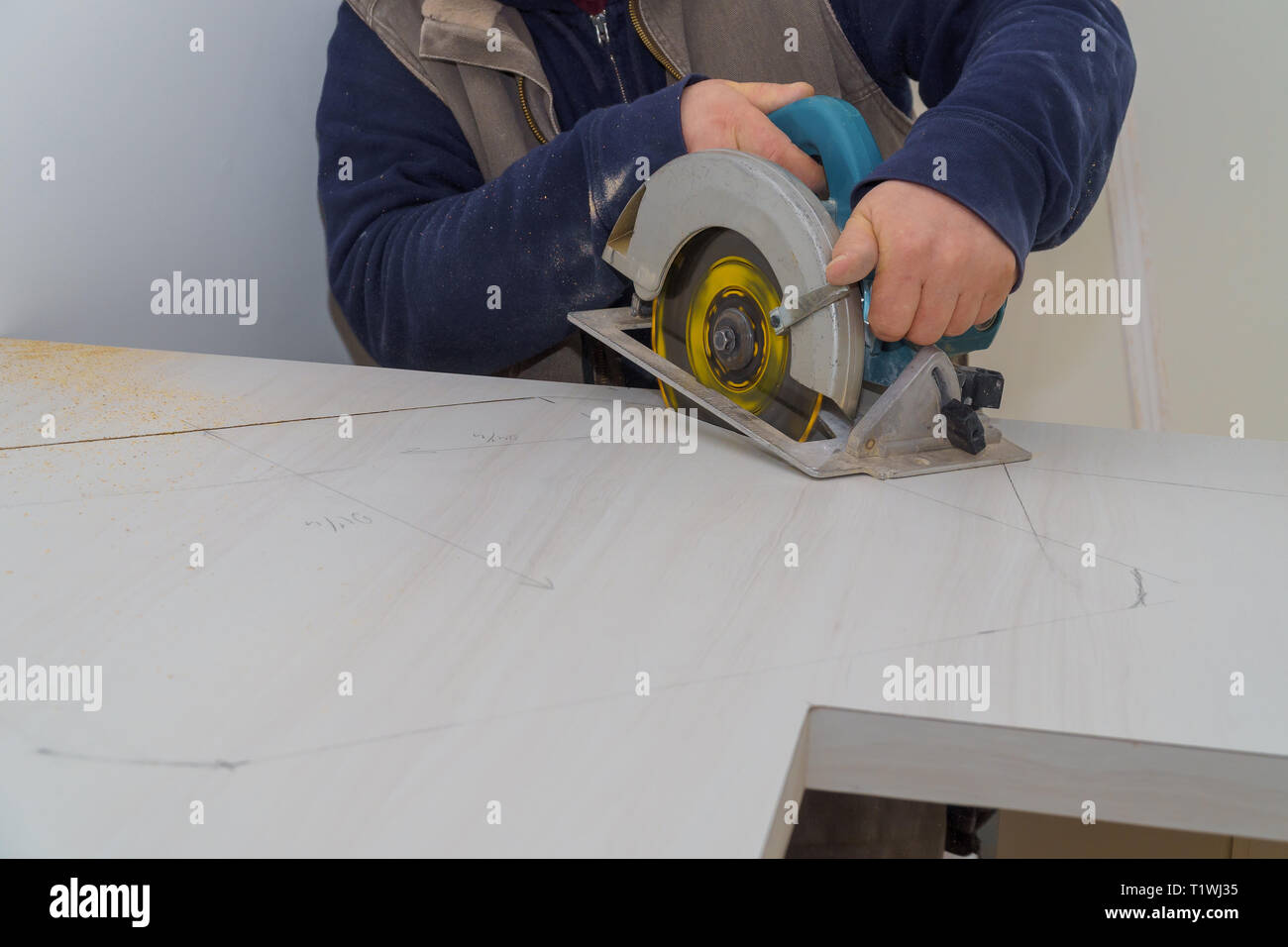 Carpenter Using Electric Saw To Cut Laminate Counter Top During A
