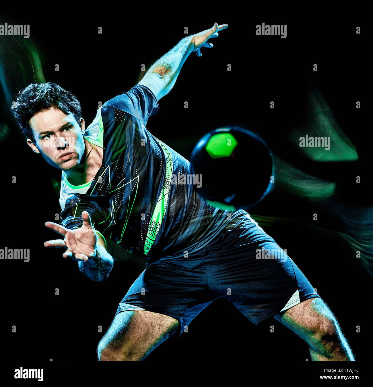 one caucasian handball player young man isolated on black background with speed light painting effect motion blur Stock Photo