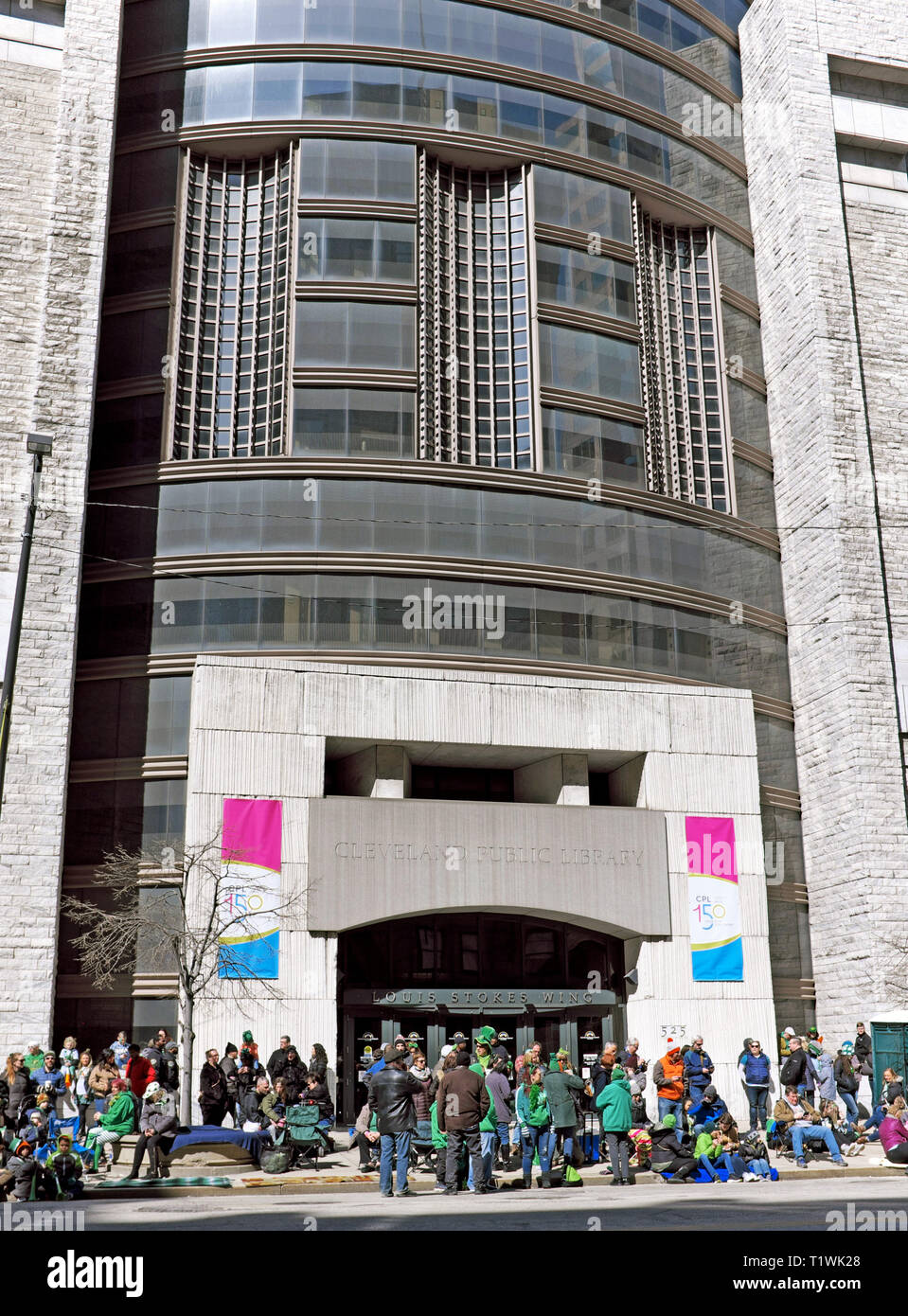 Crowds gather in front of the Cleveland Public Library on Euclid Avenue in downtown Cleveland, Ohio for the 2019 St. Patricks Day parade. Stock Photo