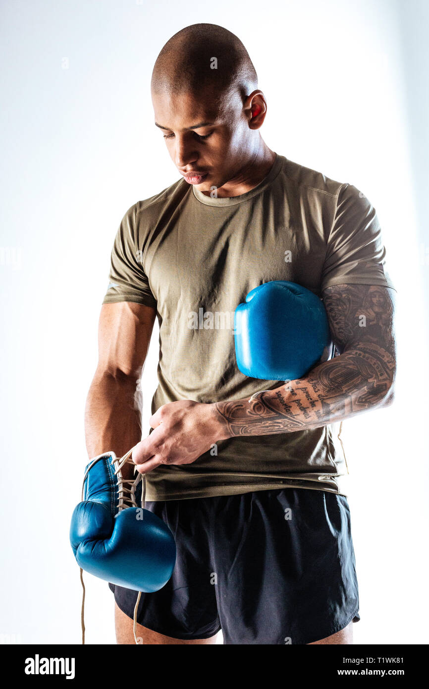 Man wearing boxing gloves before boxing training Stock Photo Alamy