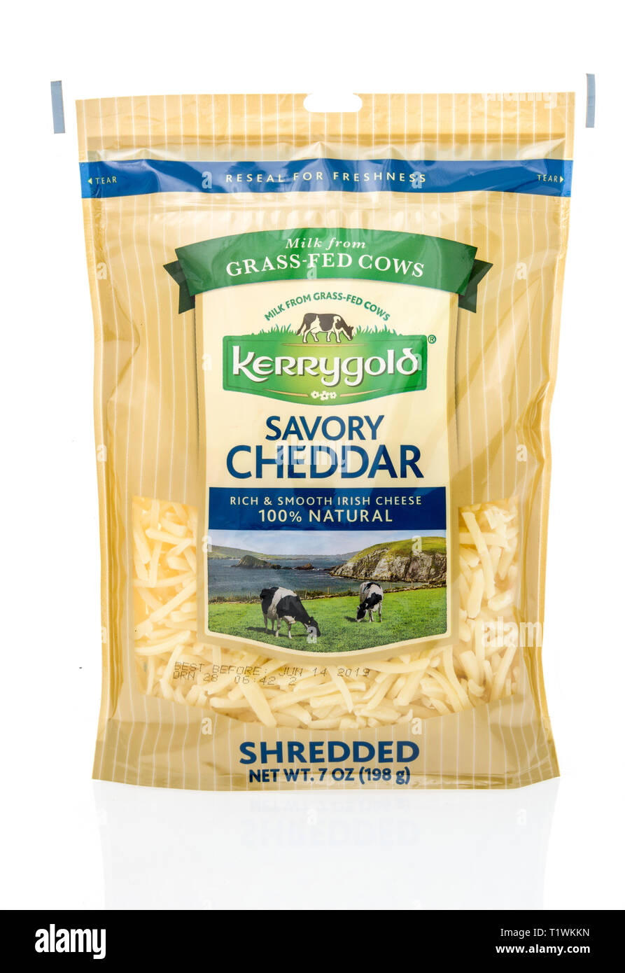 Winneconne, WI - 24 March 2019: A package of  Kerrygold savory cheddar milk from grass-fed cows shredded cheese on an isolated background Stock Photo