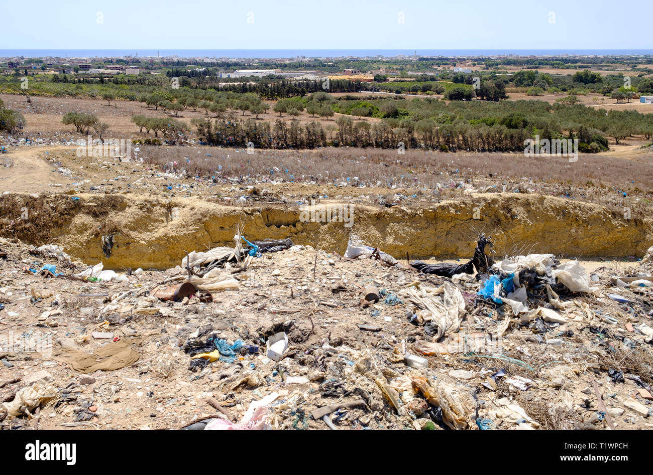 Tunisia: open-air rubbish tip near Kelibia. Waste and plastic bags scattered by the wind Stock Photo